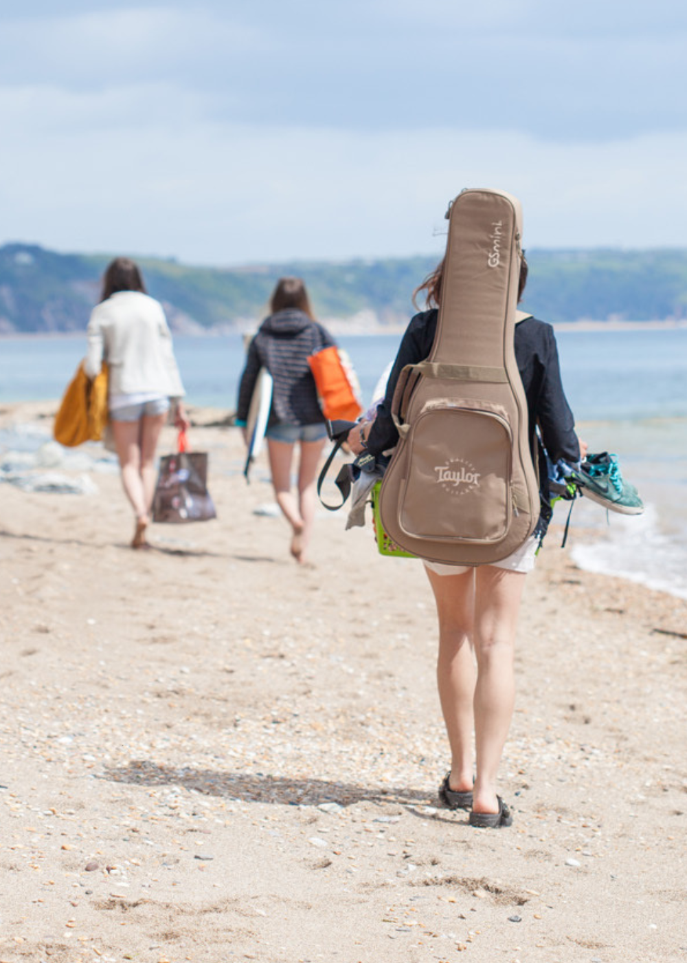 Walking along Slapton Sands beach at Torcross, reflecting the coastal lifestyle and inspiration behind Helen Butler Designs